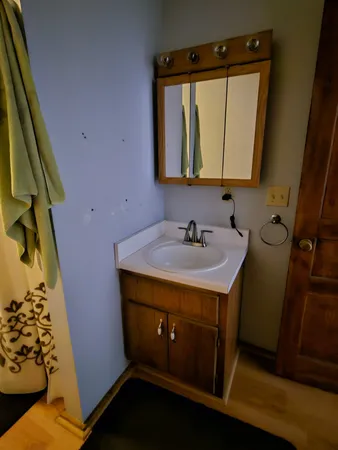 a view of a kitchen from the hallway