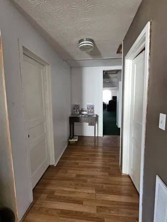 a living room with furniture fireplace and window