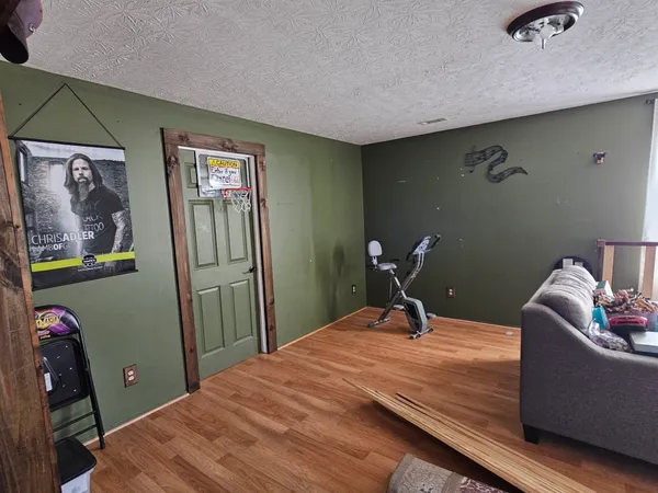 a living room with hard wood floors