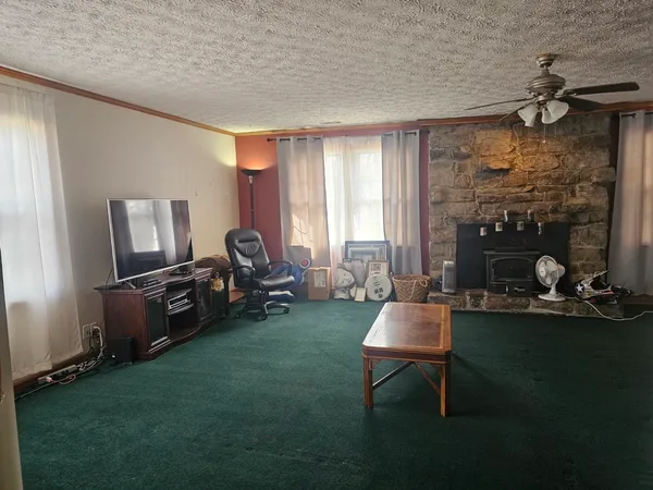 a room with pool table and windows