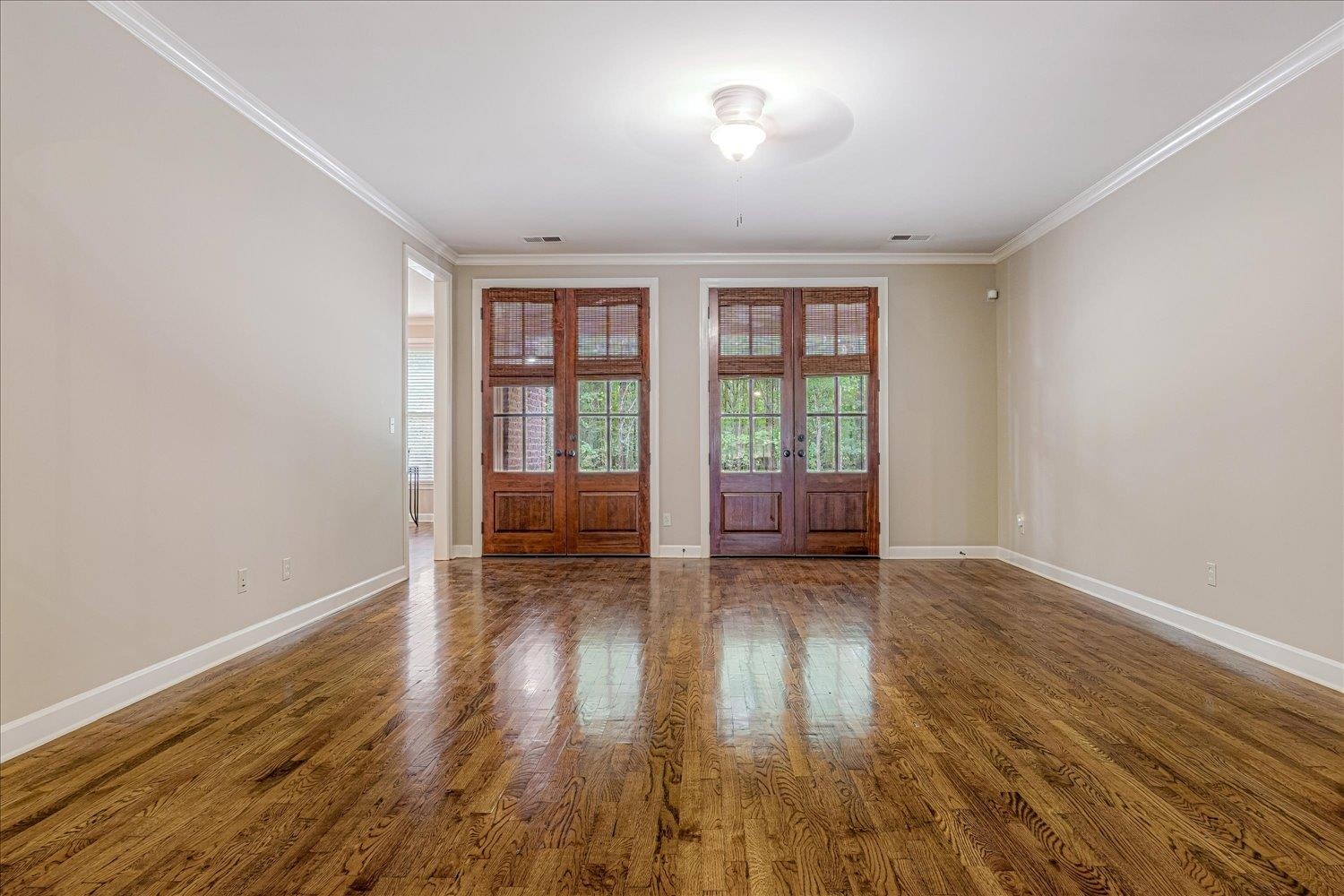 4597 Whisper Spring Drive Collierville, TN 38017 - Photo 12 of 40 Spare room featuring ornamental molding, french doors, and dark wood-style floors