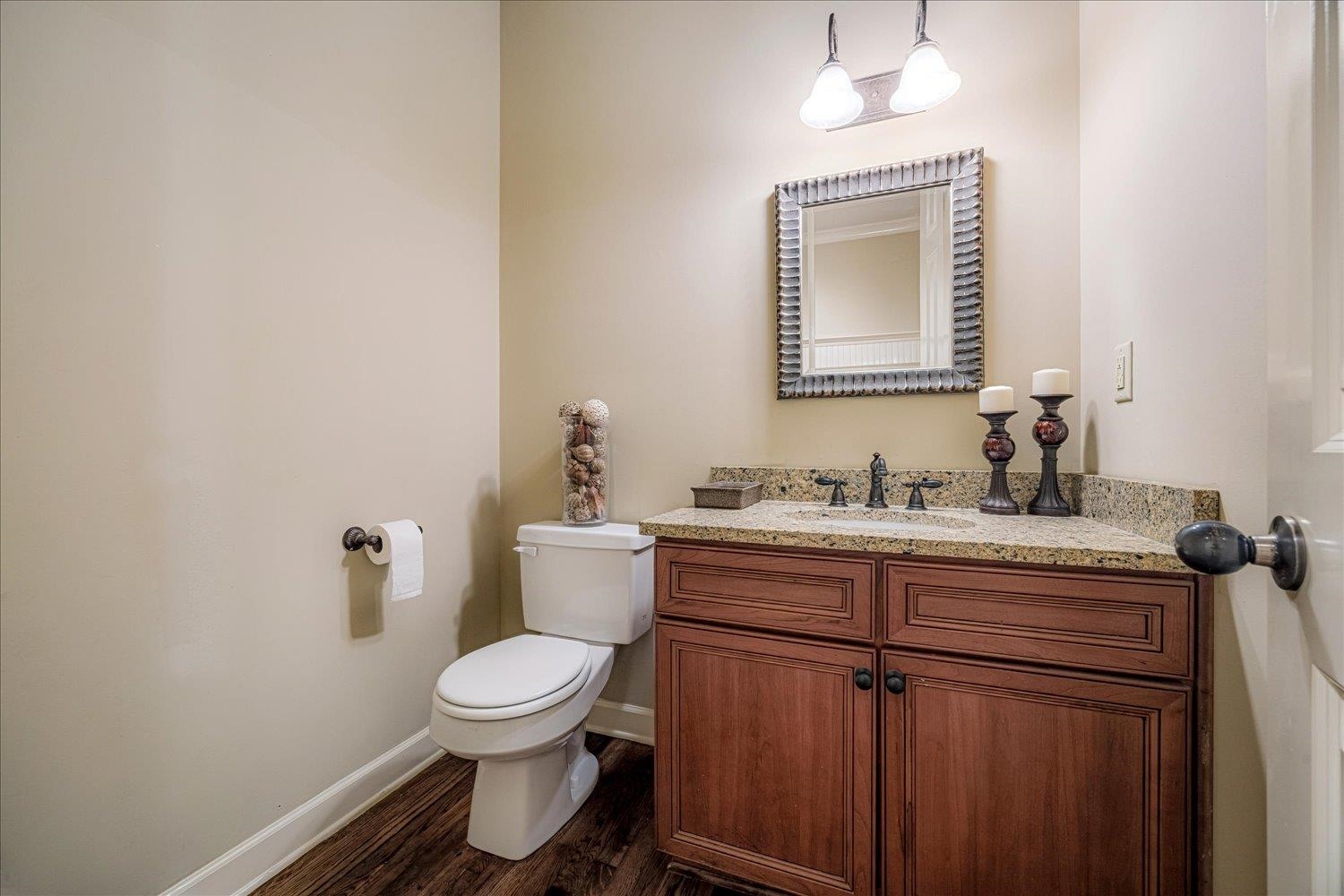 4597 Whisper Spring Drive Collierville, TN 38017 - Photo 14 of 40 Half bathroom featuring vanity and dark wood-style floors