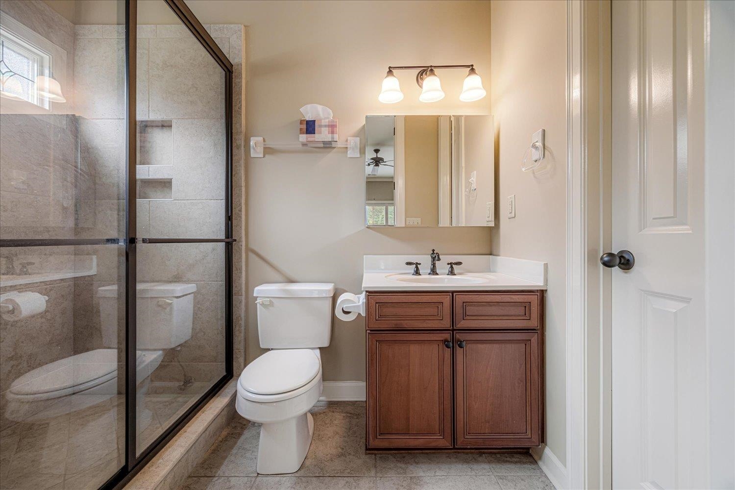 4597 Whisper Spring Drive Collierville, TN 38017 - Photo 26 of 40 Full bath featuring a stall shower, vanity, and light tile patterned floors