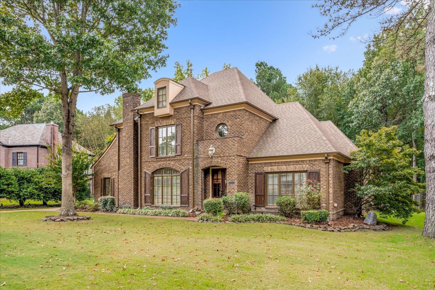 4597 Whisper Spring Drive Collierville, TN 38017 - Photo 3 of 40 View of front facade featuring brick siding, a front yard, and a shingled roof
