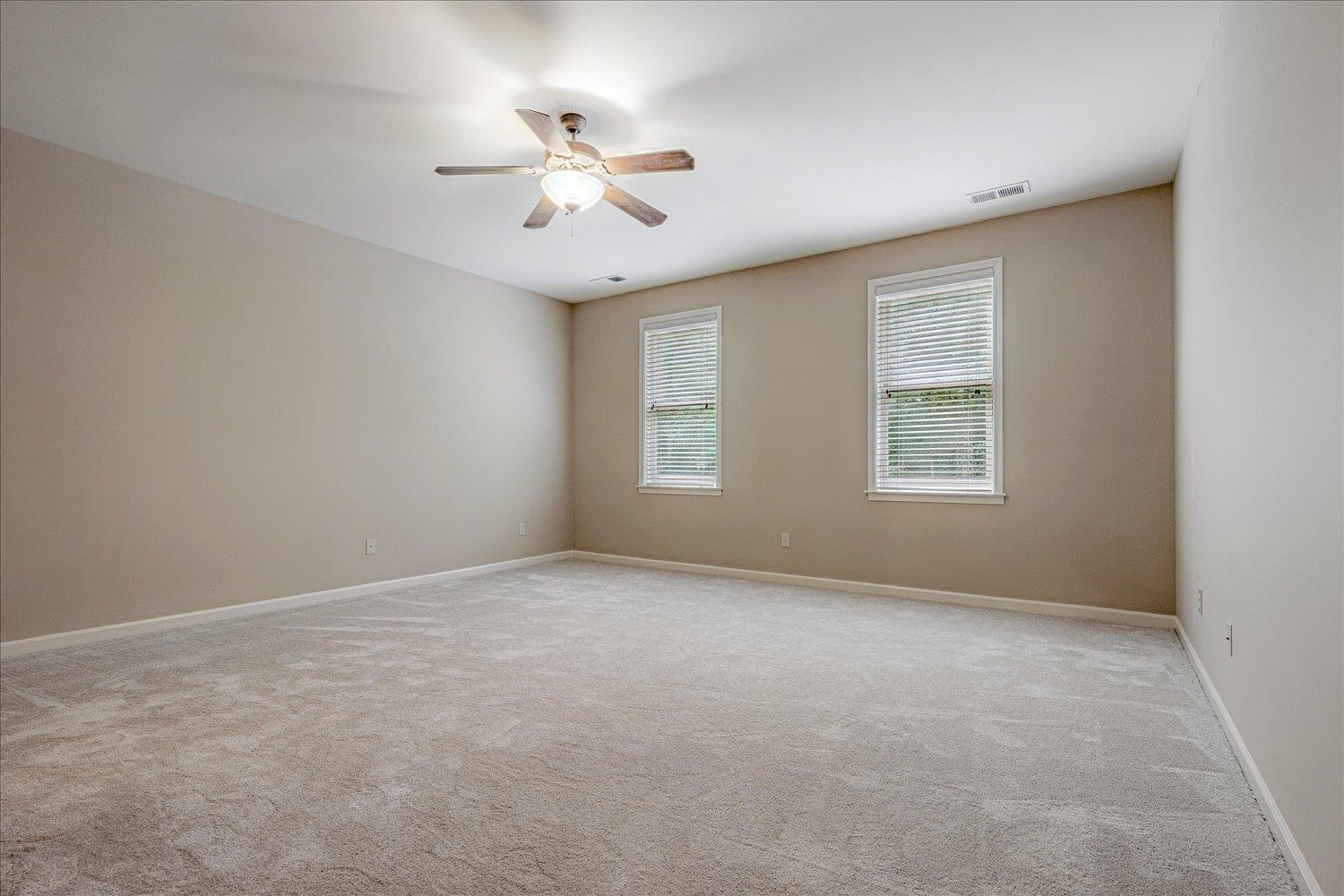 4597 Whisper Spring Drive Collierville, TN 38017 - Photo 33 of 40 Unfurnished room featuring light carpet and ceiling fan