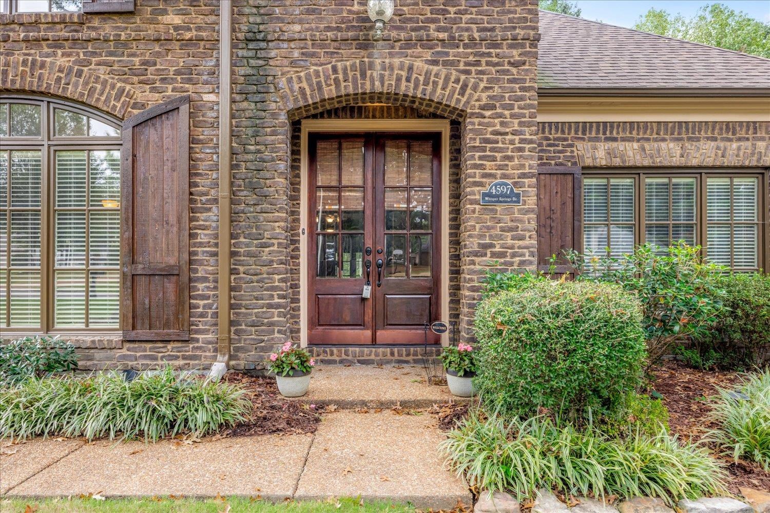 4597 Whisper Spring Drive Collierville, TN 38017 - Photo 4 of 40 Property entrance with brick siding, french doors, and a shingled roof