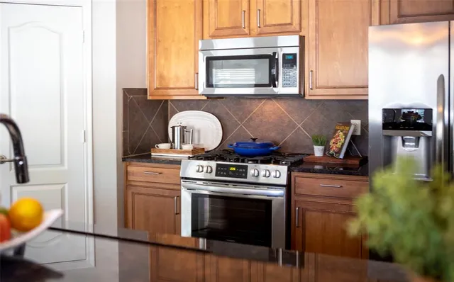 a kitchen with a stove and a microwave