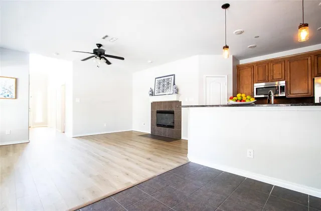 a view of a kitchen with a sink and a stove top oven