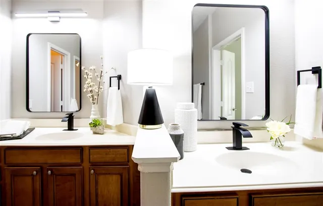 a bathroom with a sink vanity and a mirror