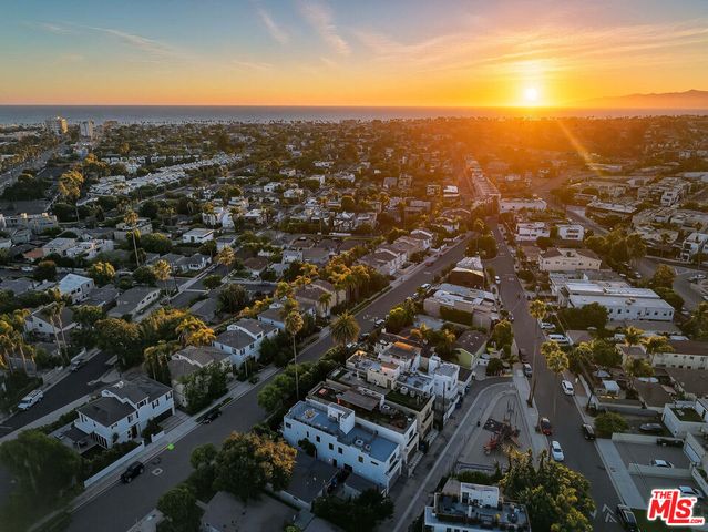 an aerial view of residential building with parking