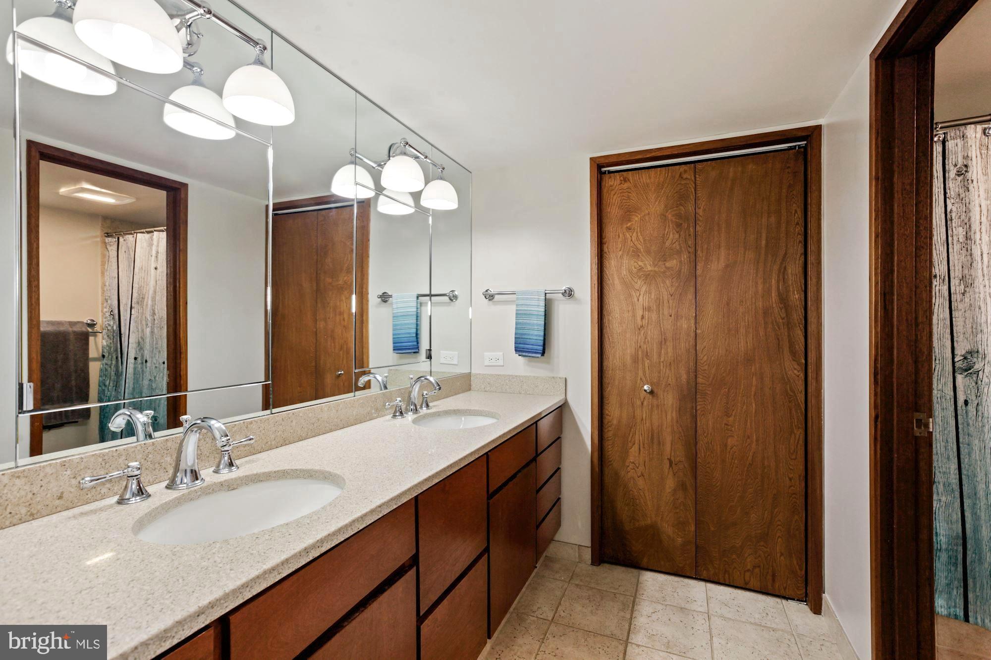 11008 Fawsett Road Potomac, MD 20854 - Photo 16 of 31 Updated Owner's Suite bathroom with dual vanities.