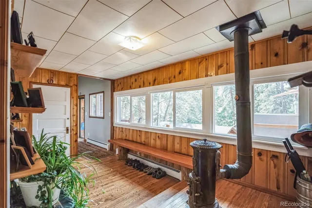 a living room with furniture next to a large window