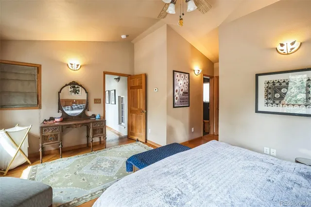 a bedroom with bed and wooden furniture
