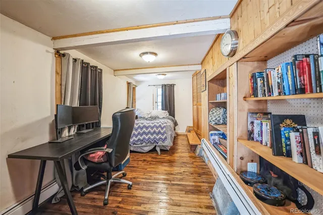 a living room with lots of furniture and a book shelf