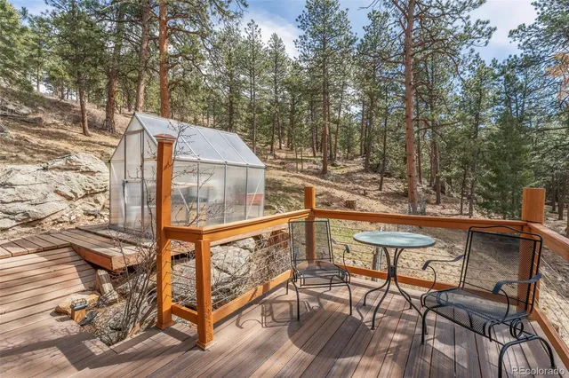 a view of a house with a yard covered in snow