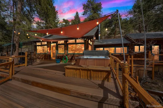 a view of a deck with chairs and a yard