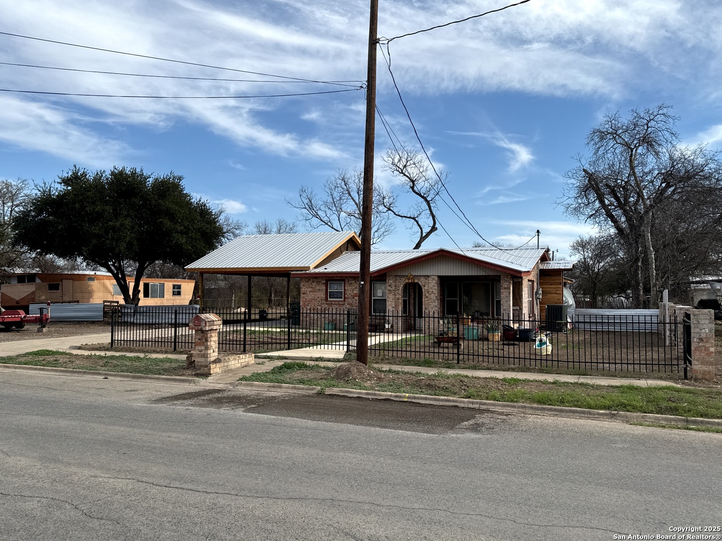 713 Boone Street Uvalde, TX 78801 - Photo 2 of 31 a view of street with houses