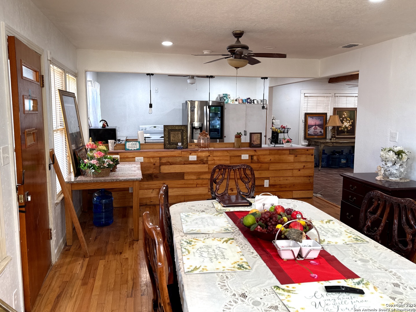 713 Boone Street Uvalde, TX 78801 - Photo 10 of 31 a large kitchen with a table and chairs in it