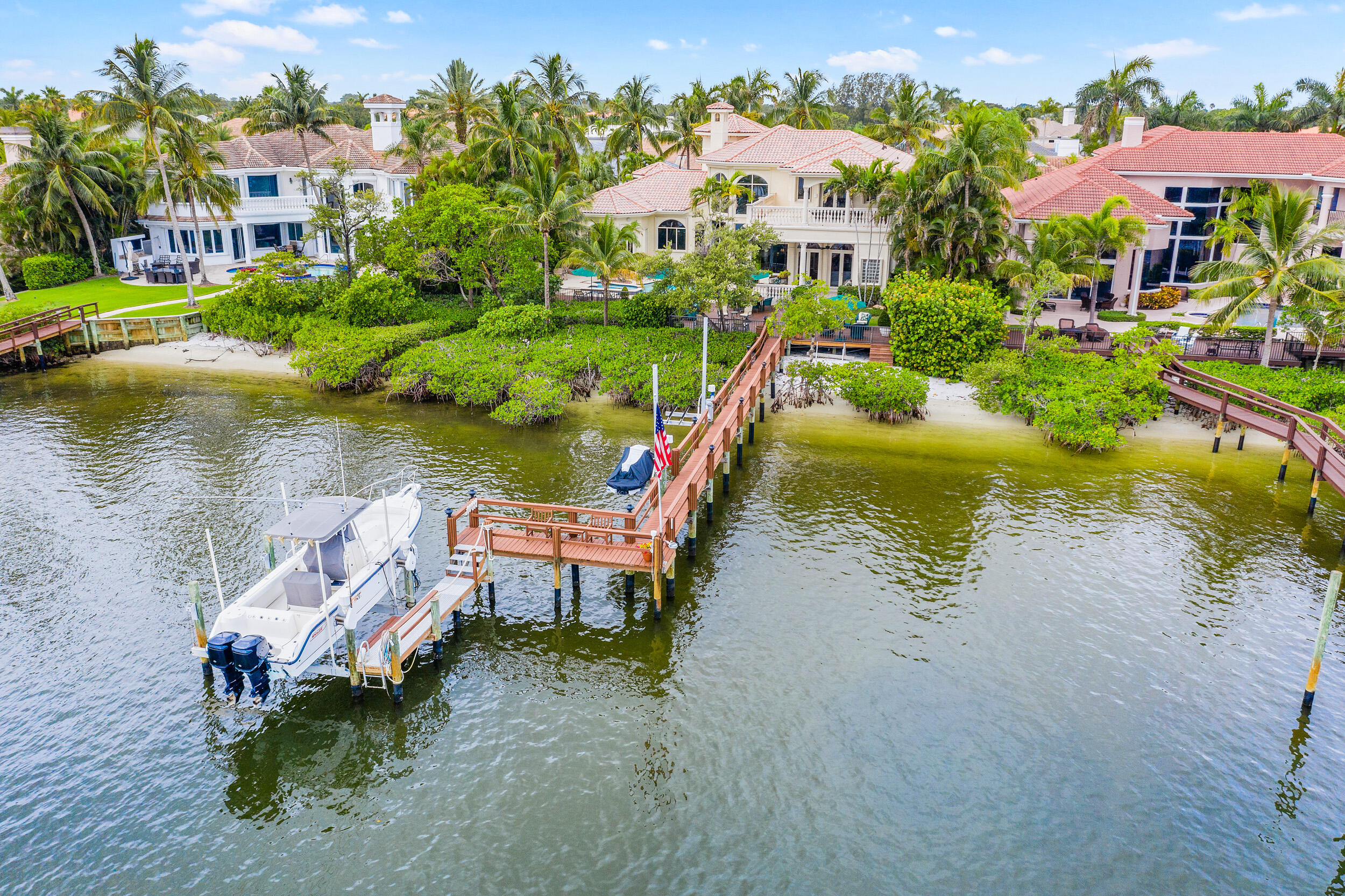 3152 Casseekey Island Road Jupiter, FL 33477 - Photo 1 of 45 an aerial view of a house with swimming pool garden and outdoor seating