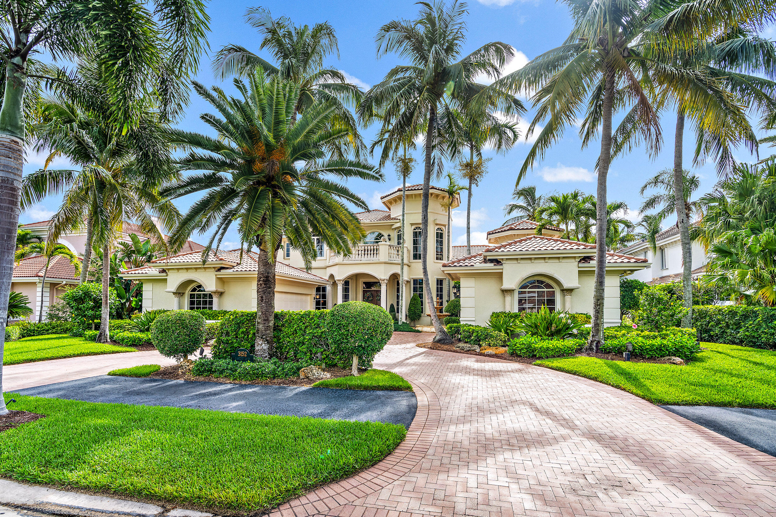3152 Casseekey Island Road Jupiter, FL 33477 - Photo 21 of 45 a front view of house with yard and green space