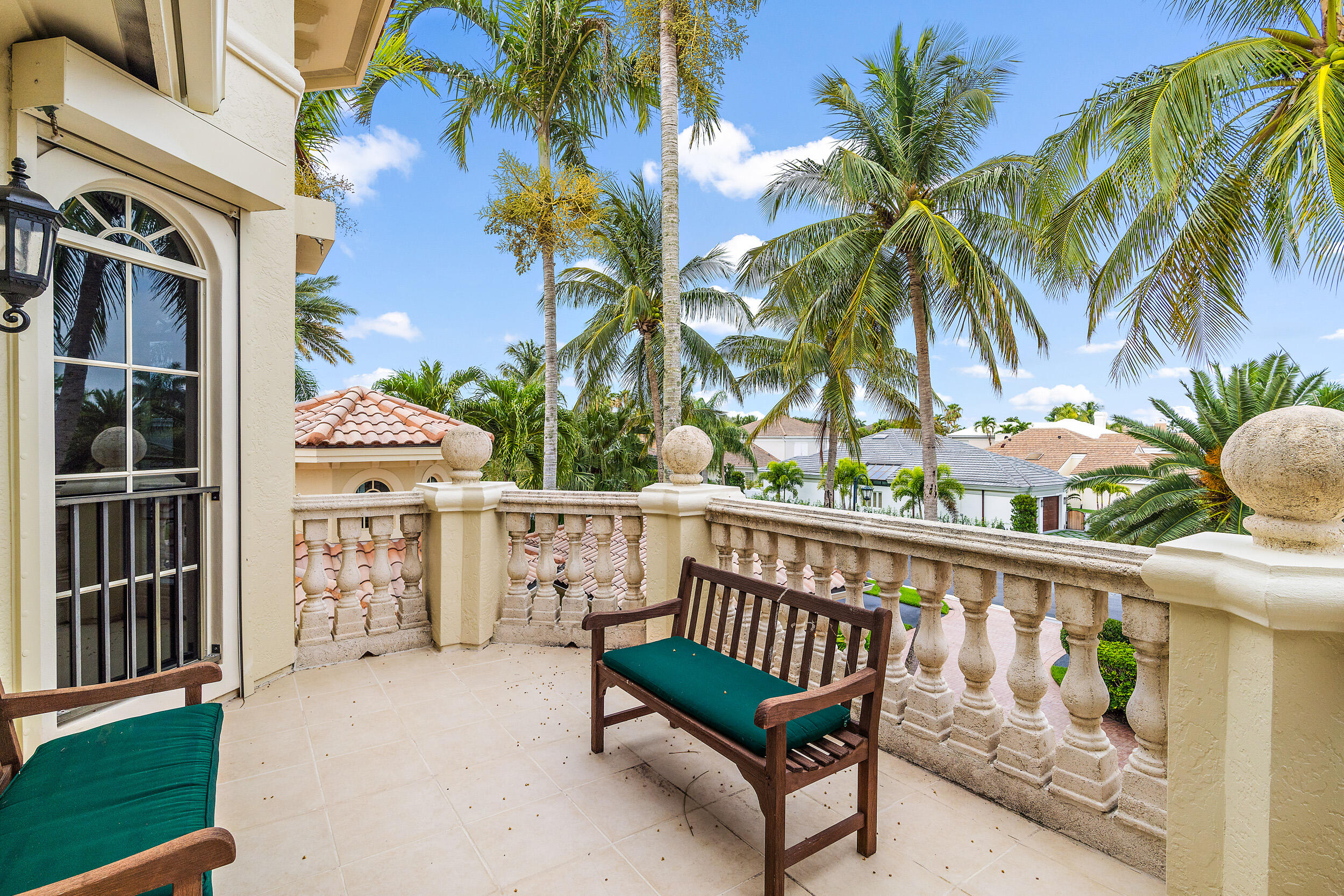3152 Casseekey Island Road Jupiter, FL 33477 - Photo 28 of 45 a view of a chair and table in the balcony