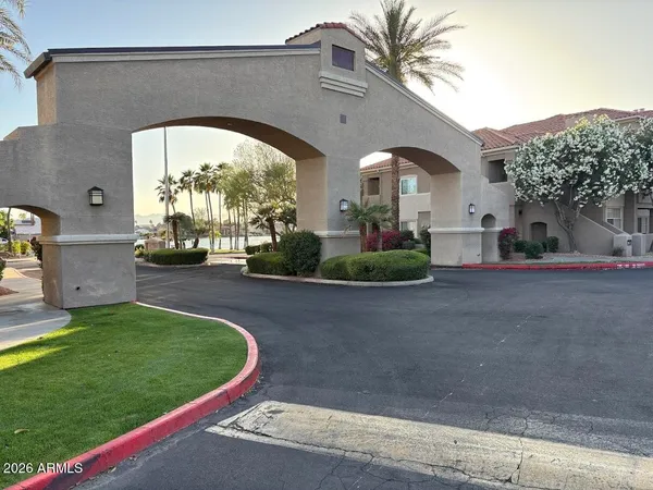 a front view of house with a garden
