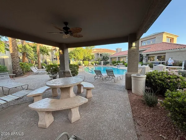 a view of a patio with a table chairs and a patio