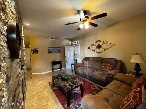 a living room with furniture and a fireplace