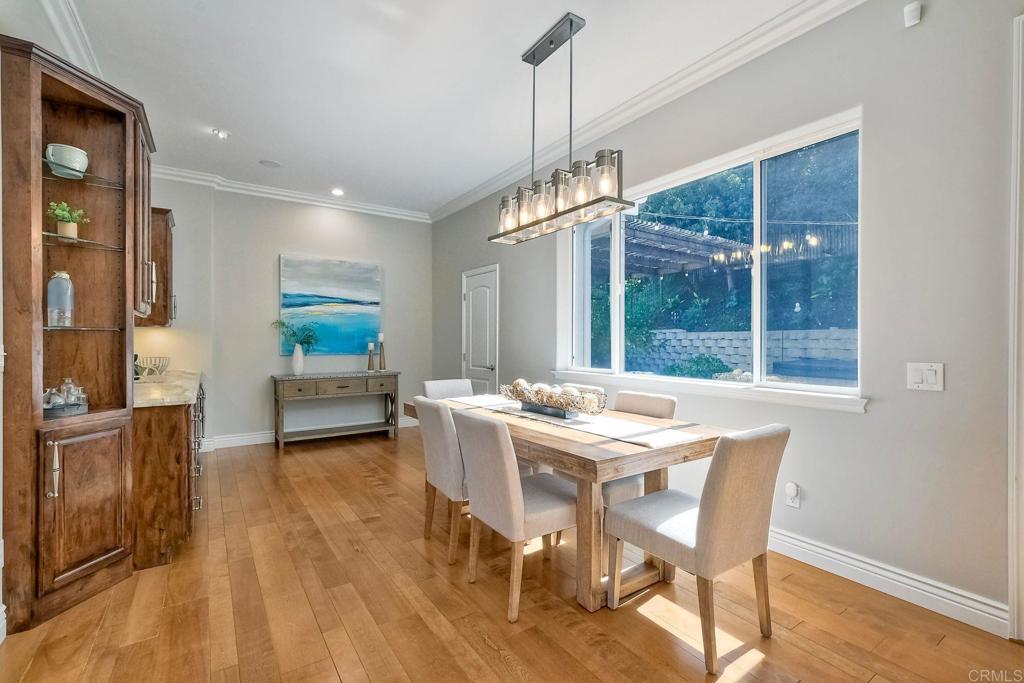 2559 Fire Mountain Drive Oceanside, CA 92054 - Photo 12 of 43 a view of a dining room with furniture window and wooden floor