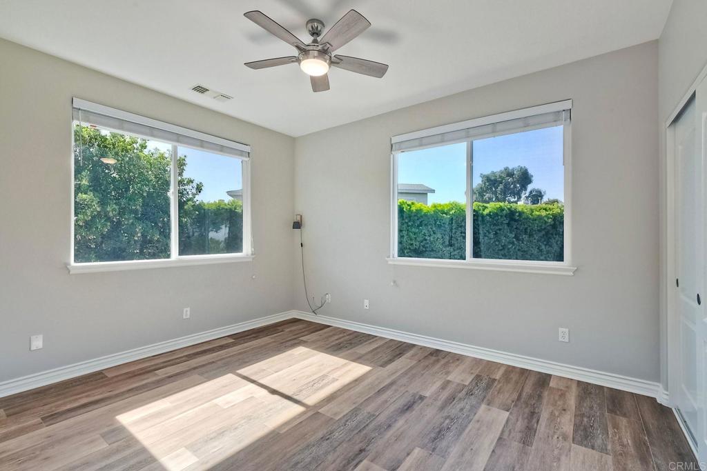 2559 Fire Mountain Drive Oceanside, CA 92054 - Photo 21 of 43 a view of empty room with wooden floor and fan