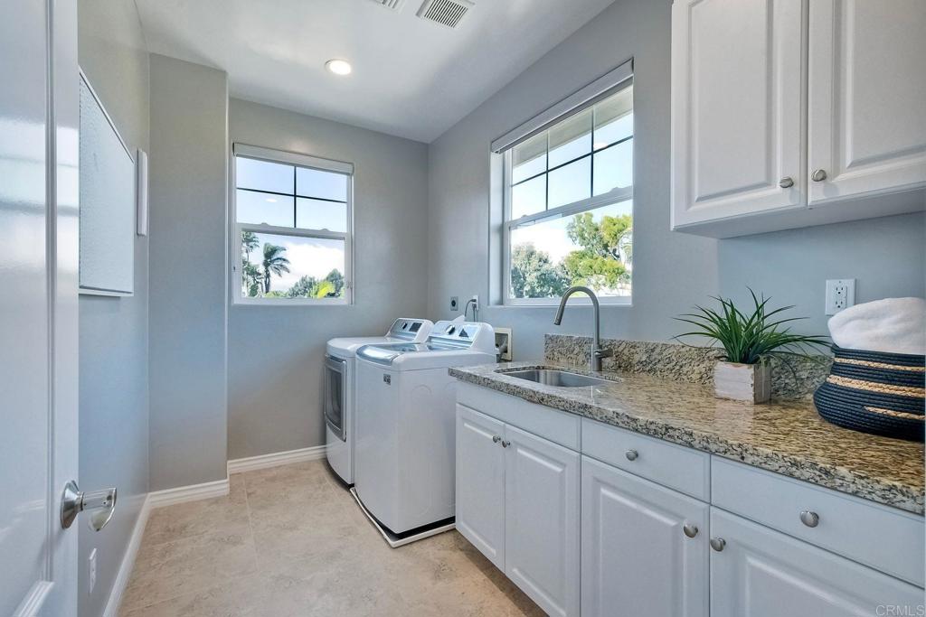 2559 Fire Mountain Drive Oceanside, CA 92054 - Photo 22 of 43 a kitchen with sink and window