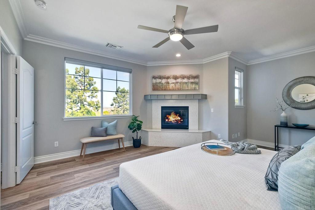 2559 Fire Mountain Drive Oceanside, CA 92054 - Photo 24 of 43 a bed room with a bed and a fireplace
