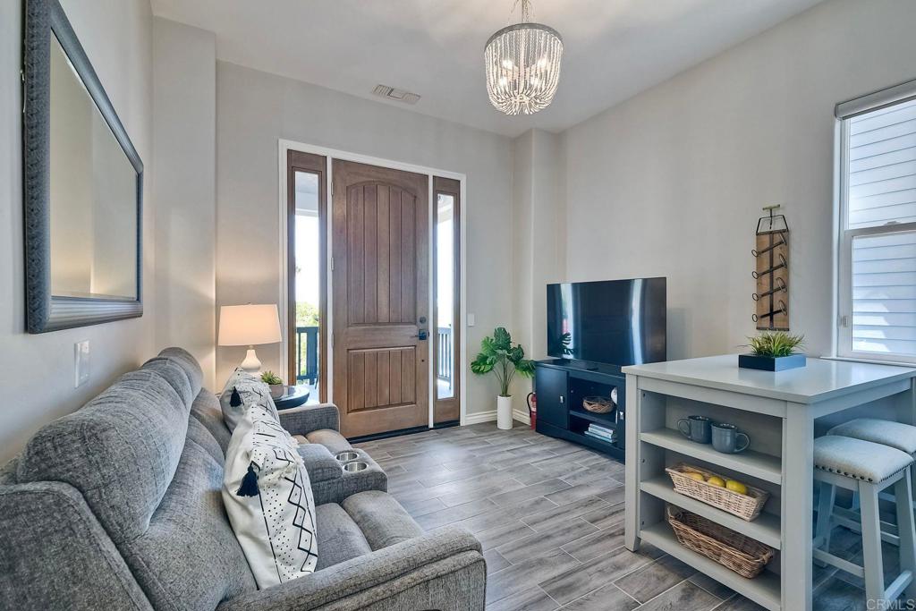 2559 Fire Mountain Drive Oceanside, CA 92054 - Photo 36 of 43 a living room with furniture and a flat screen tv