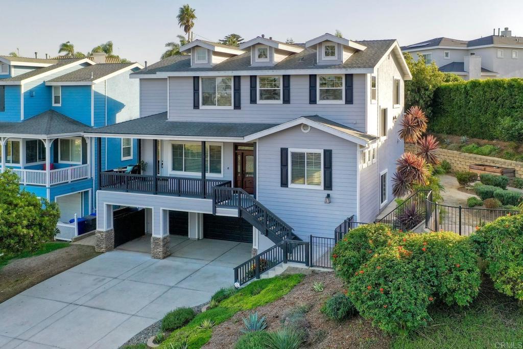 2559 Fire Mountain Drive Oceanside, CA 92054 - Photo 43 of 43 a front view of a house with a garden and plants