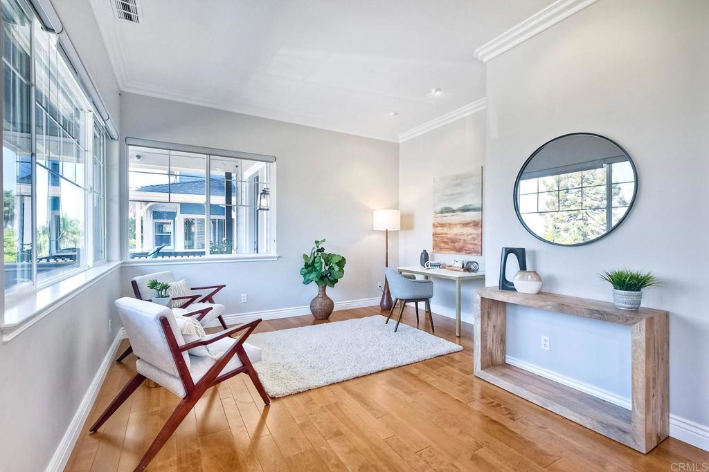 2559 Fire Mountain Drive Oceanside, CA 92054 - Photo 5 of 43 a living room with furniture a rug potted plant and a large window