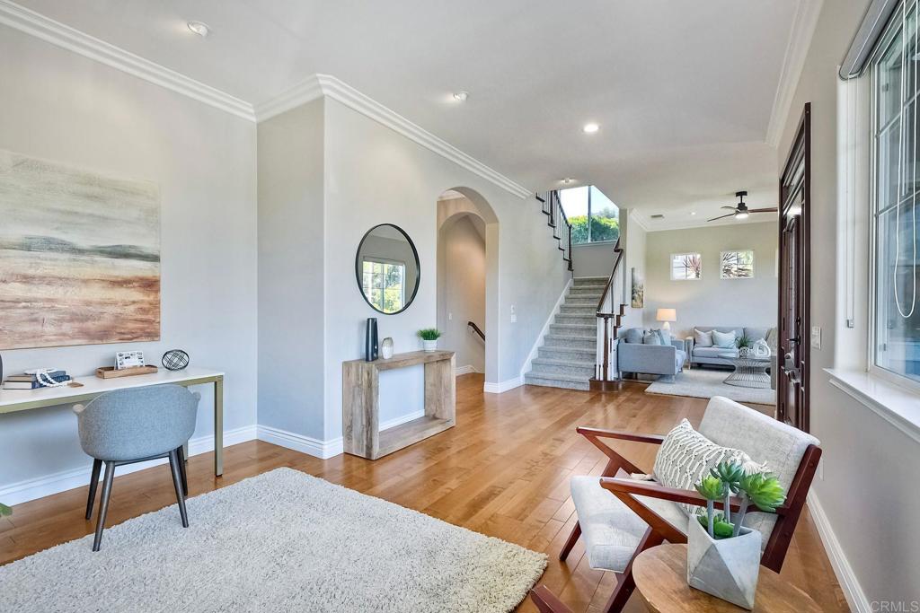 2559 Fire Mountain Drive Oceanside, CA 92054 - Photo 6 of 43 a living room with furniture and a clock