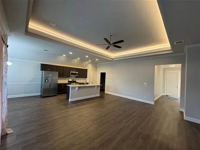 a view of kitchen with microwave and furniture