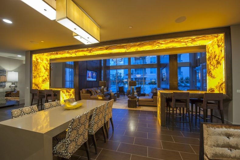 2111 Westheimer Road, Unit 1401 Houston, TX 77098 - Photo 10 of 16 a view of a dining room with furniture and chandelier