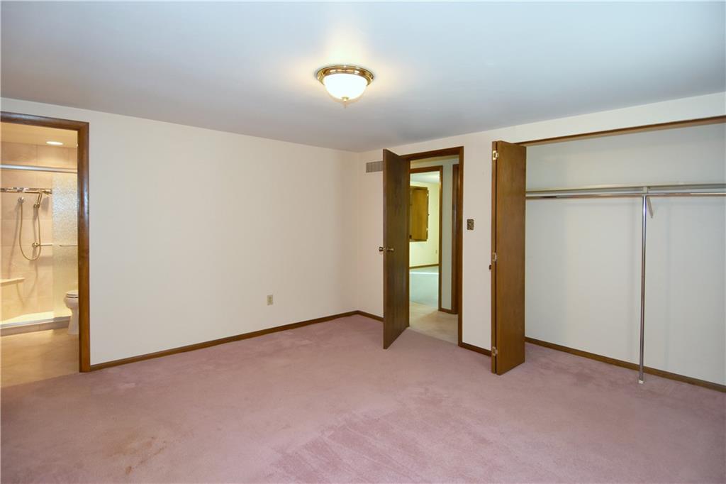 413 Thompson Run Road Pittsburgh, PA 15237 - Photo 17 of 25 an empty room with closet and a hallway