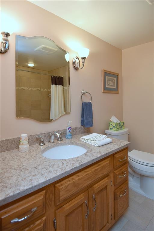 413 Thompson Run Road Pittsburgh, PA 15237 - Photo 19 of 25 a bathroom with a granite countertop sink and a mirror