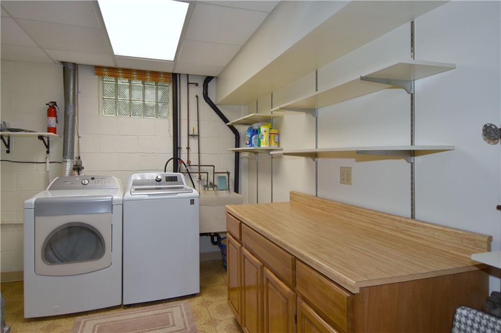 413 Thompson Run Road Pittsburgh, PA 15237 - Photo 24 of 25 a utility room with dryer and washer