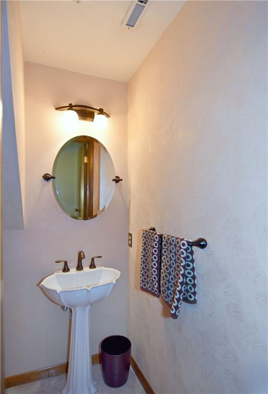 413 Thompson Run Road Pittsburgh, PA 15237 - Photo 25 of 25 a bathroom with a sink and mirror