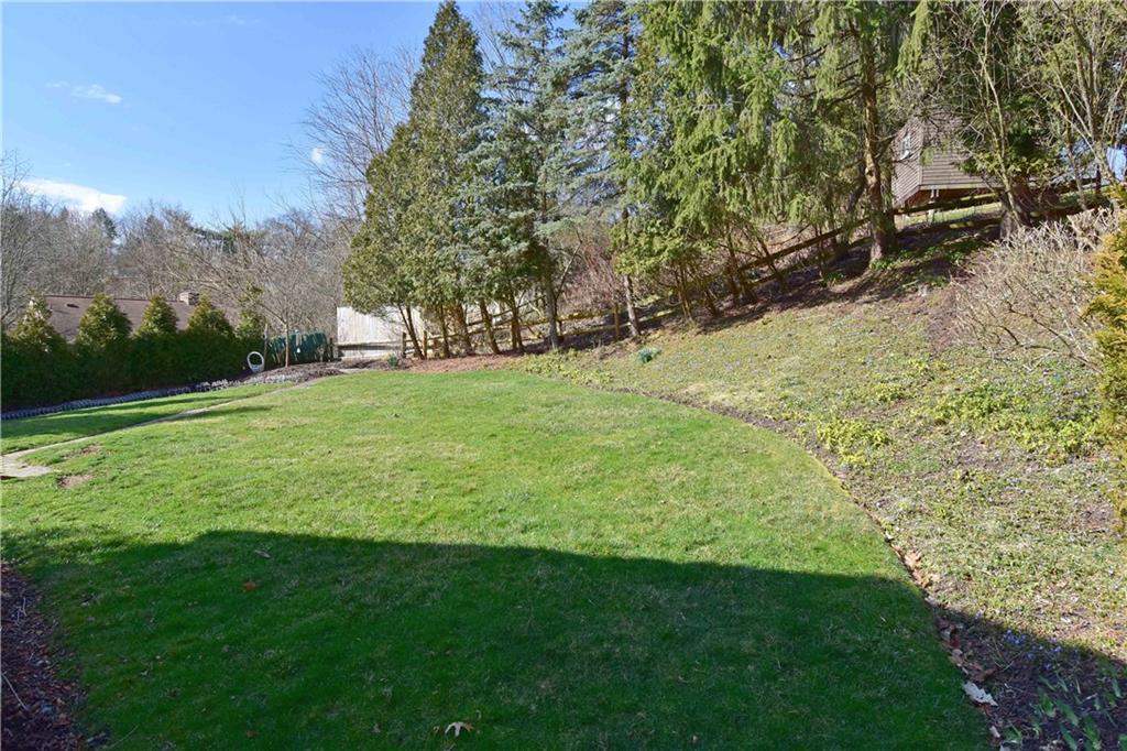 413 Thompson Run Road Pittsburgh, PA 15237 - Photo 4 of 25 a view of a backyard with large trees