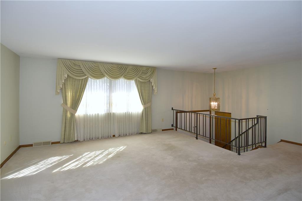 413 Thompson Run Road Pittsburgh, PA 15237 - Photo 10 of 25 a view of a livingroom with a staircase