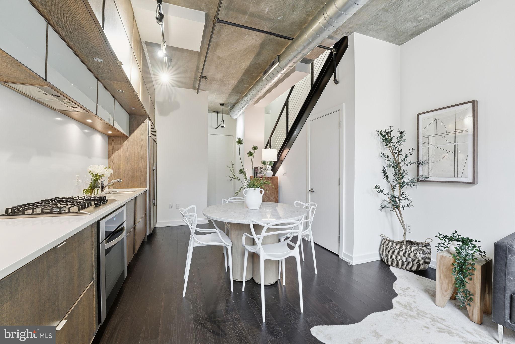 1515 15th Street Northwest, Unit 234 Washington, DC 20005 - Photo 11 of 33 a view of a dining room with furniture and wooden floor