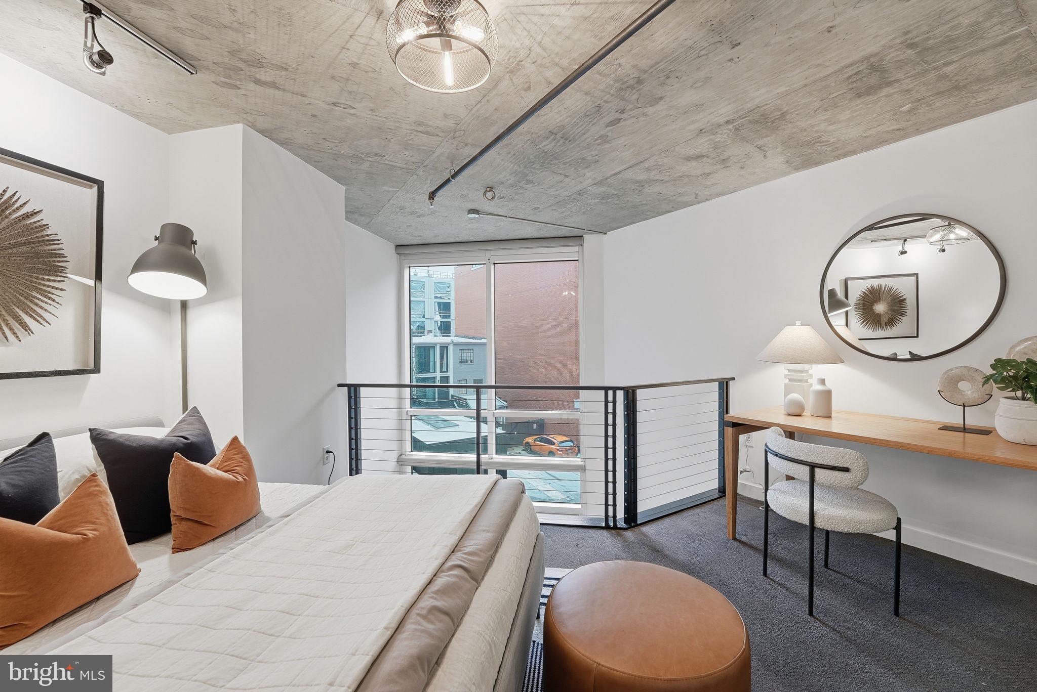 1515 15th Street Northwest, Unit 234 Washington, DC 20005 - Photo 13 of 33 a living room with furniture a rug and a clock