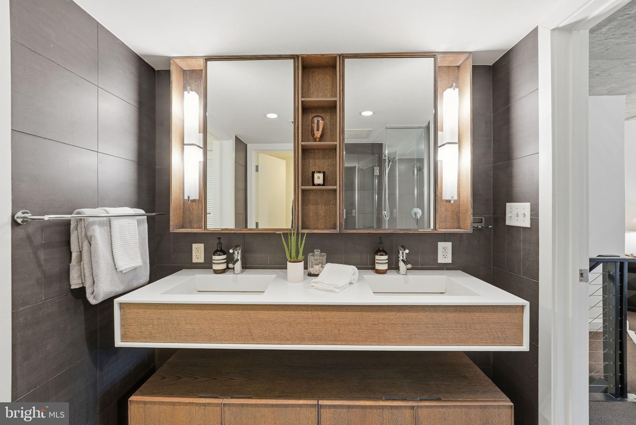 1515 15th Street Northwest, Unit 234 Washington, DC 20005 - Photo 16 of 33 a bathroom with a sink and a mirror