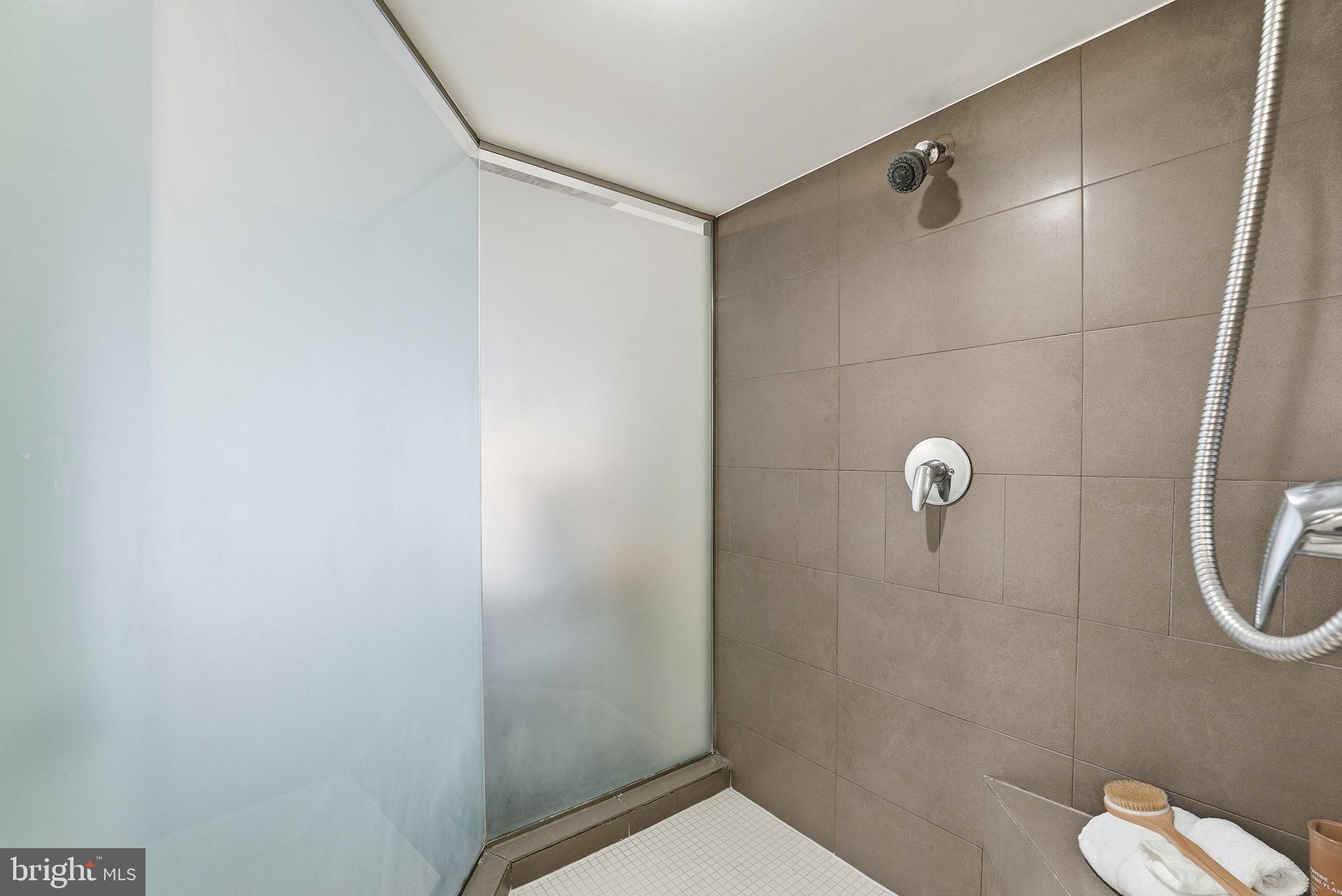 1515 15th Street Northwest, Unit 234 Washington, DC 20005 - Photo 18 of 33 a bathroom with a shower and toilet