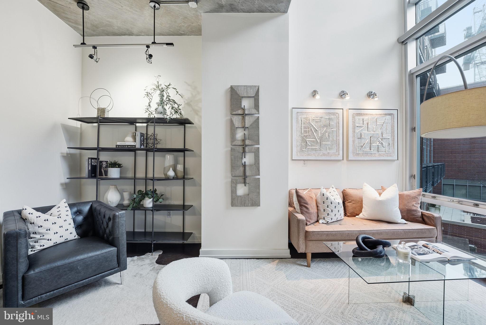 1515 15th Street Northwest, Unit 234 Washington, DC 20005 - Photo 4 of 33 a living room with furniture and a couch