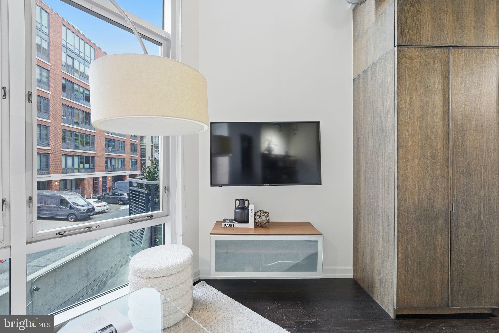 1515 15th Street Northwest, Unit 234 Washington, DC 20005 - Photo 6 of 33 a bathroom with a toilet a sink and mirror